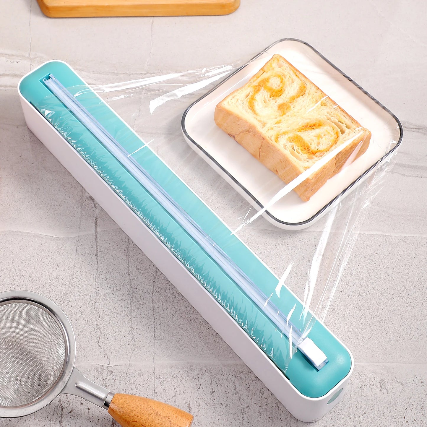 Multi-functional cling film cutter, tear-free sliding suitable for plastic and aluminum foil.